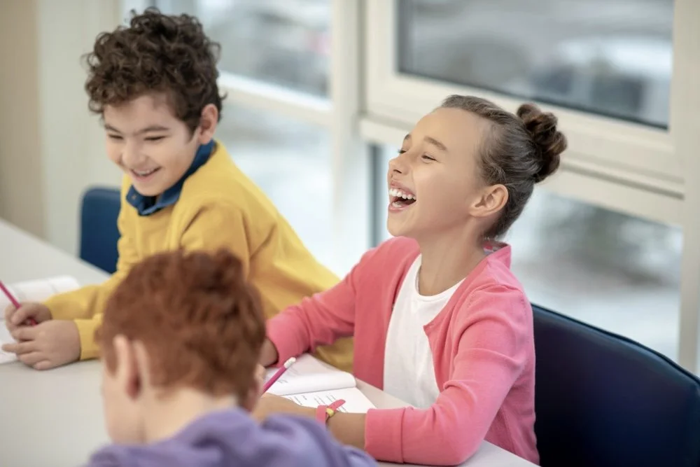 Smiling students in a neurodivergent school in Laguna Hills CA