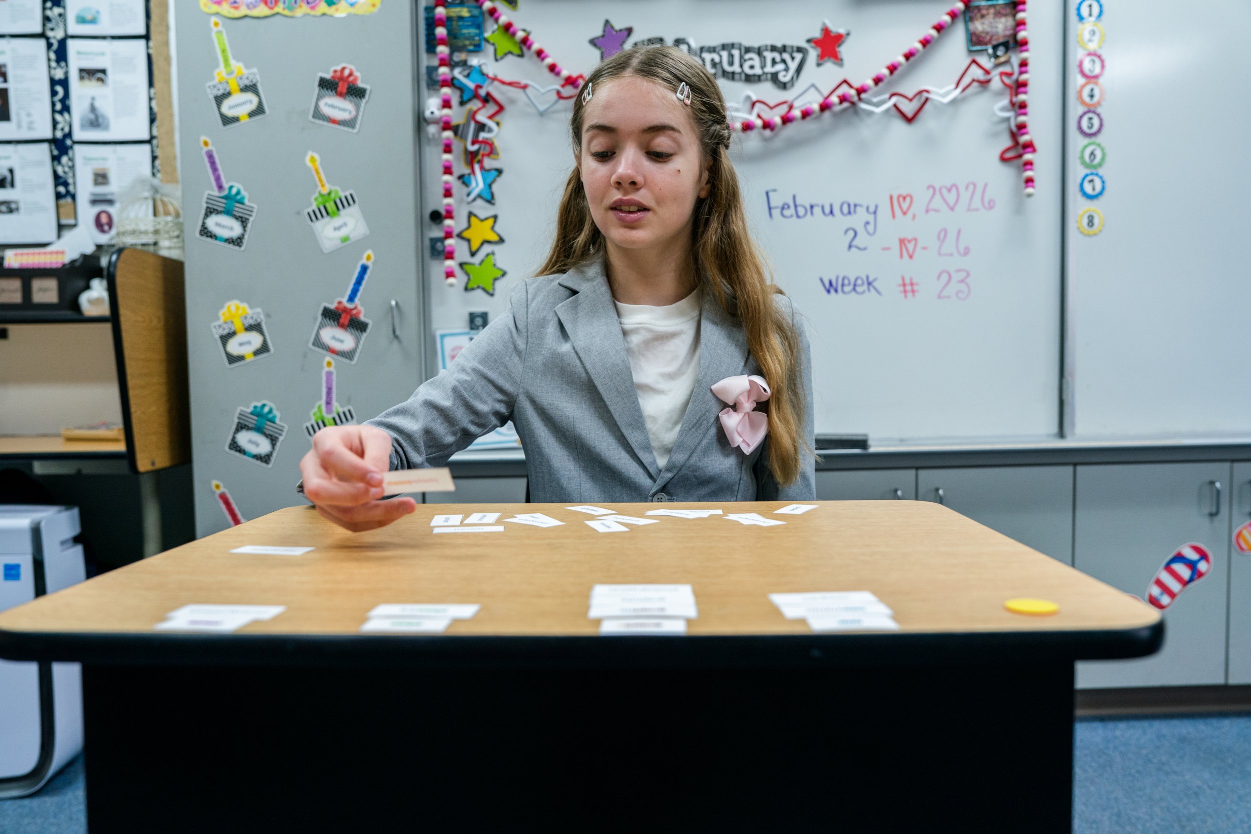 Pathway middle school student working with learning cards at her desk