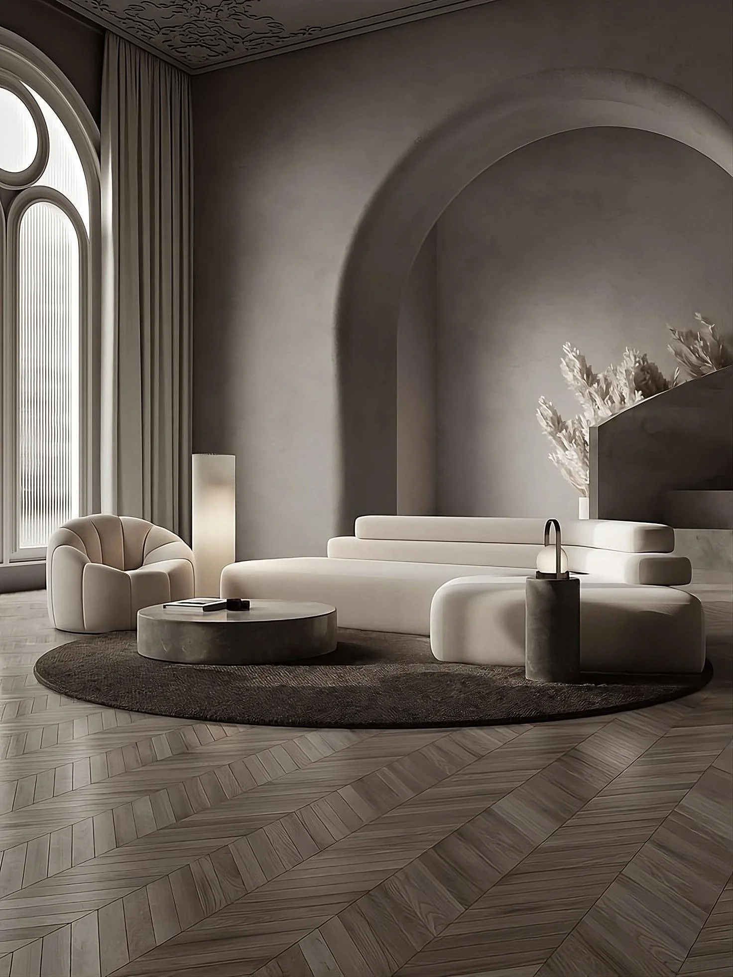 Minimalist living room with neutral tones, featuring a modern curved sofa, round coffee table, plush armchair, arched wall niche, and large arch window with floor-to-ceiling curtains, on herringbone wood flooring.