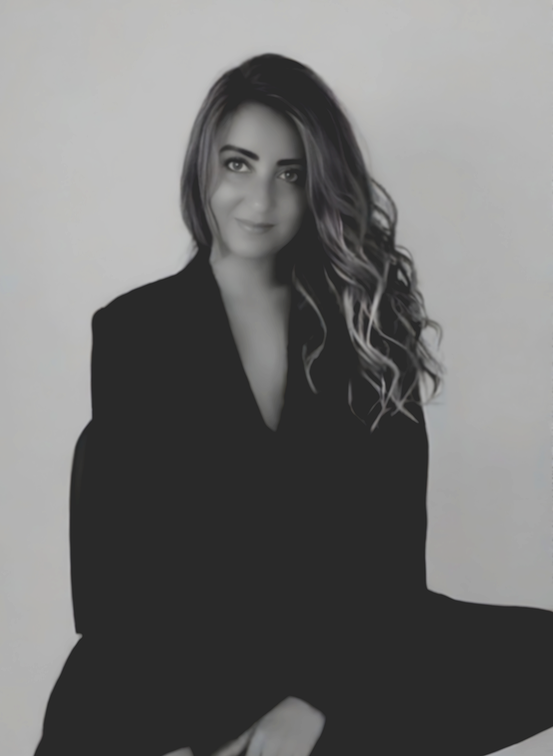 Dominique Rose, founder of Barefoot Luxury Living, in a serene, light-filled setting expressing quiet luxury and intentional living