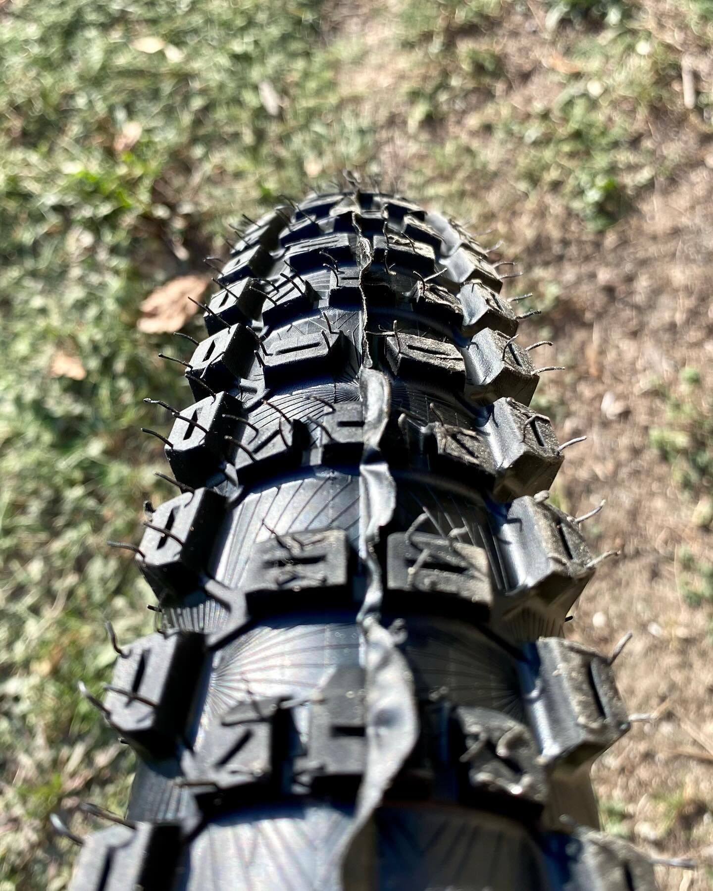 Most modern MTB tyres have a very square profile. A square edge is said to dig in to soft dirt better. 

A quick look at an MX tyre, which is designed for much softer and deeper terrain is almost a perfect semi circle? 

My favourite tyre over the la