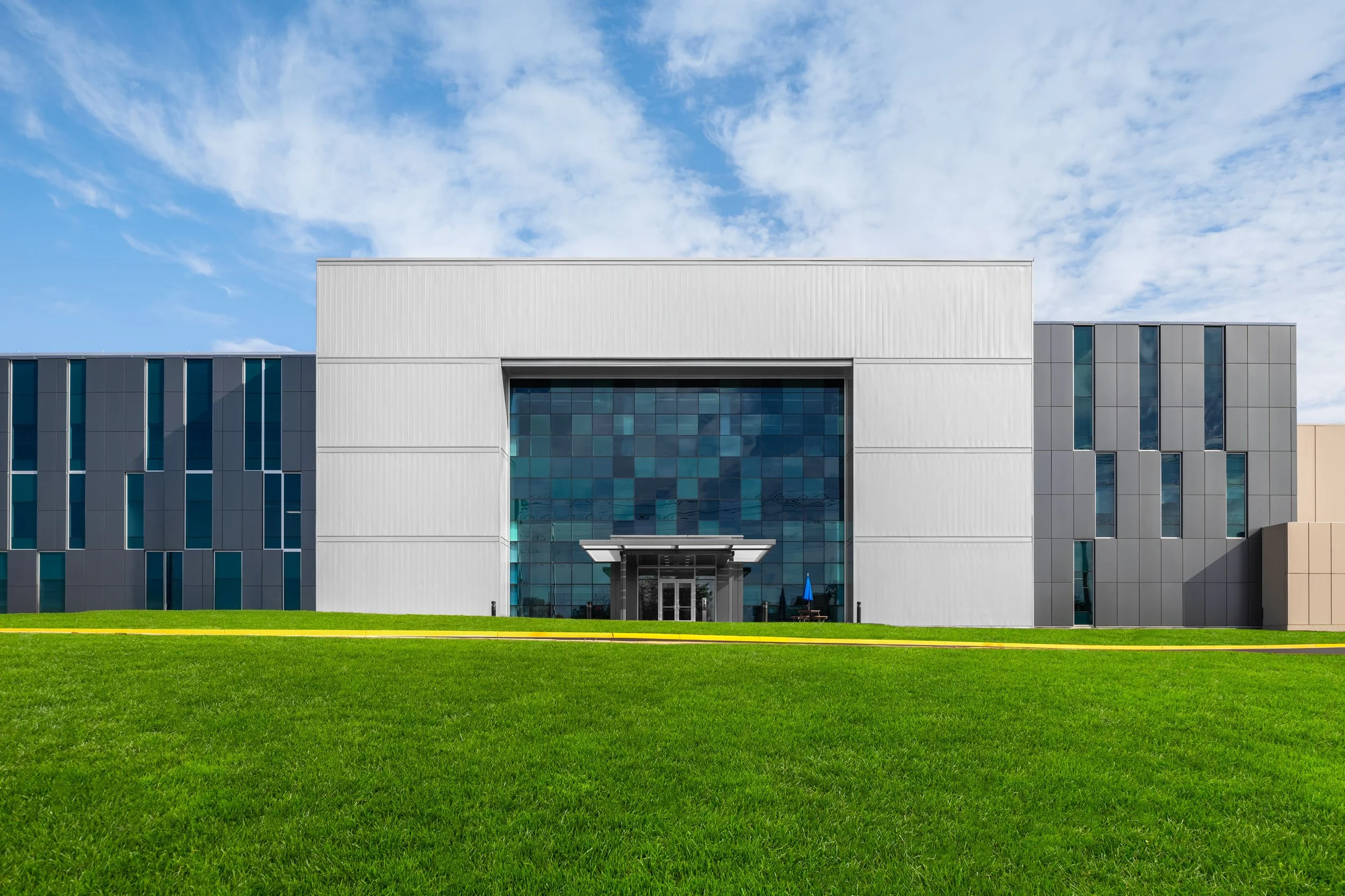 Modern building with a large glass facade in Manassas, Virginia.