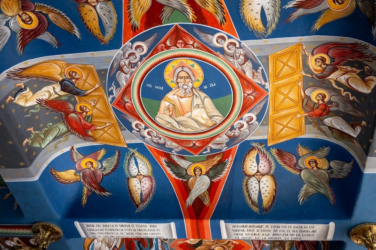 Religious mural depicting Christ surrounded by angels and saints, with vibrant colors and intricate details.