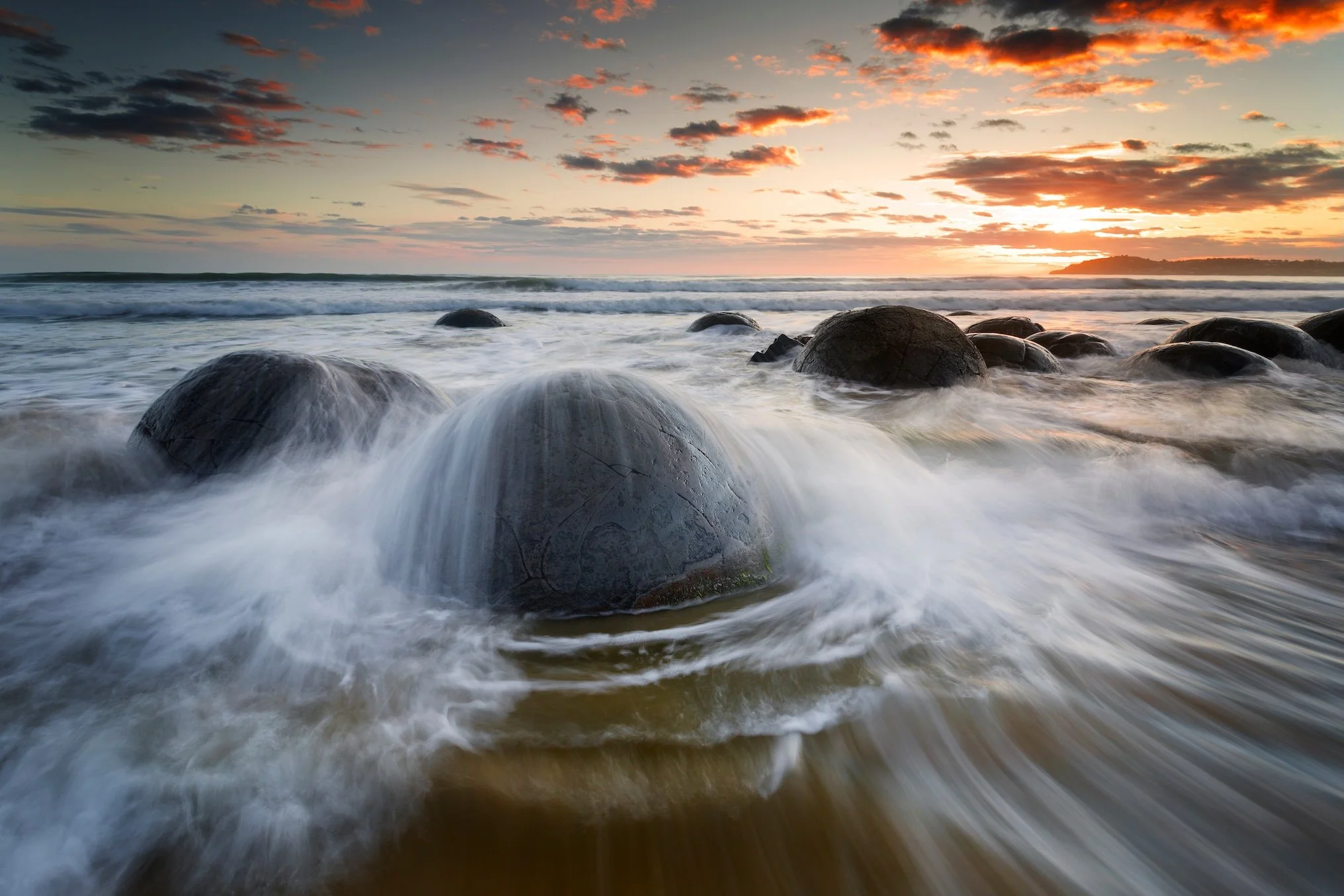 Moeraki giant boulders on the beach in New Zealand washed by water