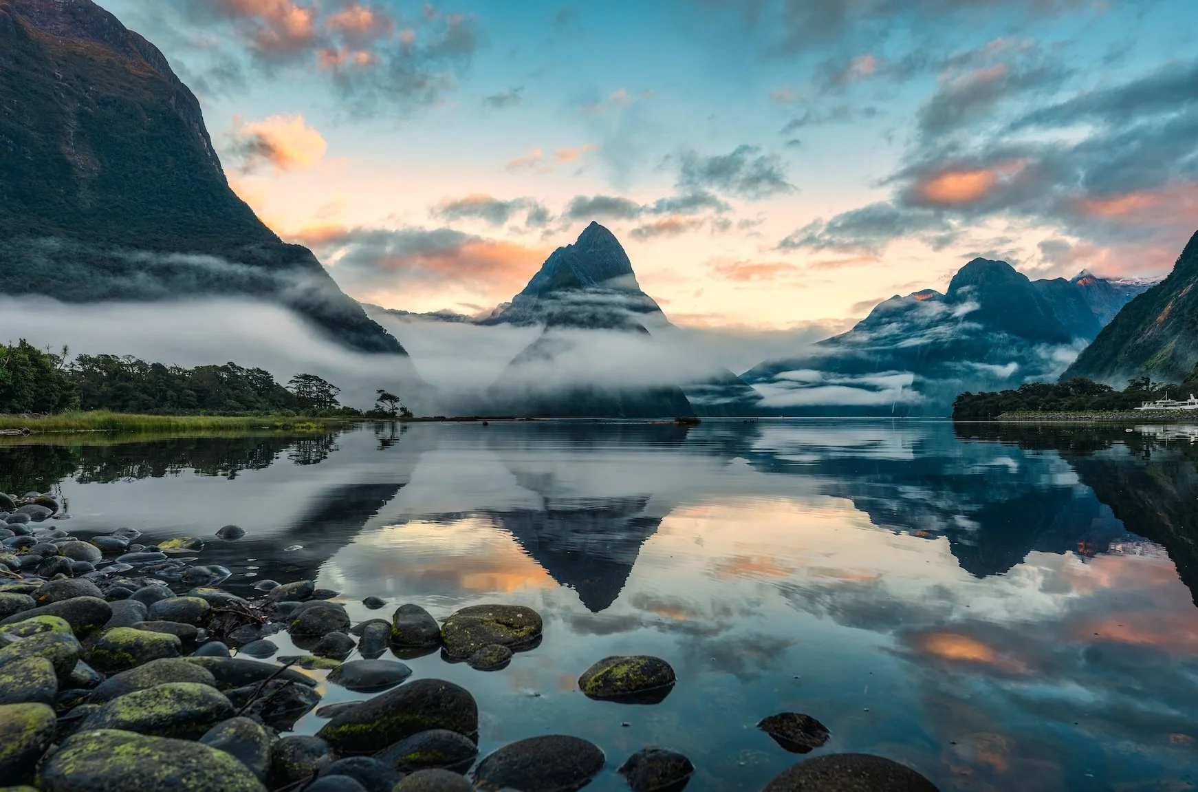Milford Sound New Zealand at Sunrise with reflection in still water