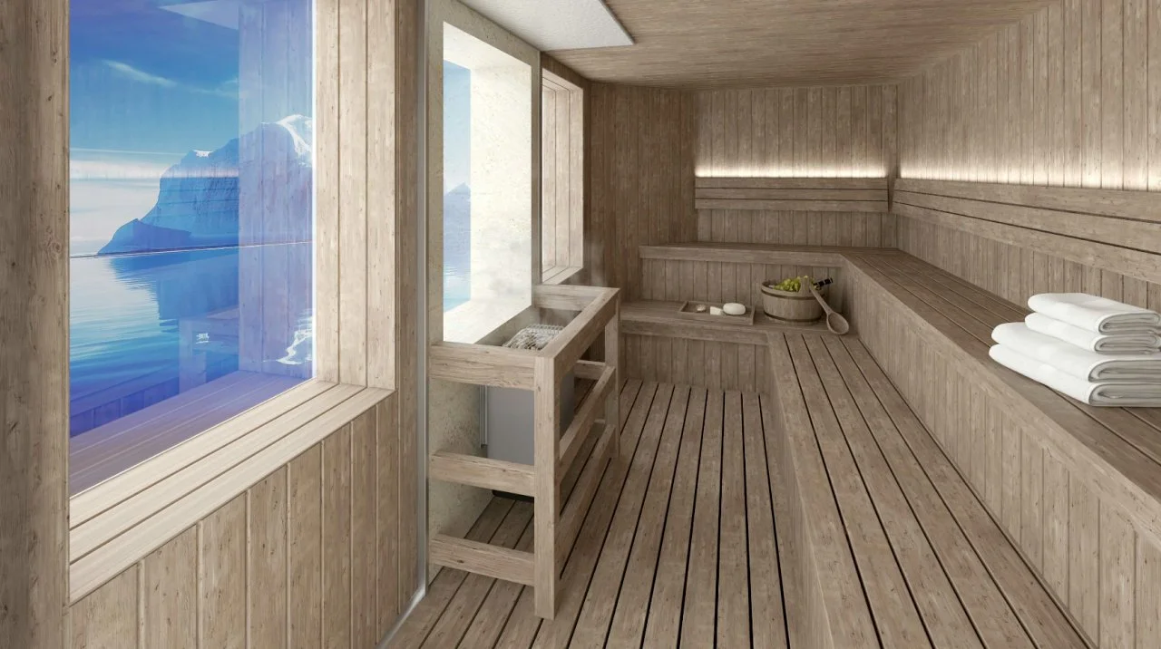 Interior view of Magellan Discoverer sauna with bench seating, towels, and large windows offering Antarctic views