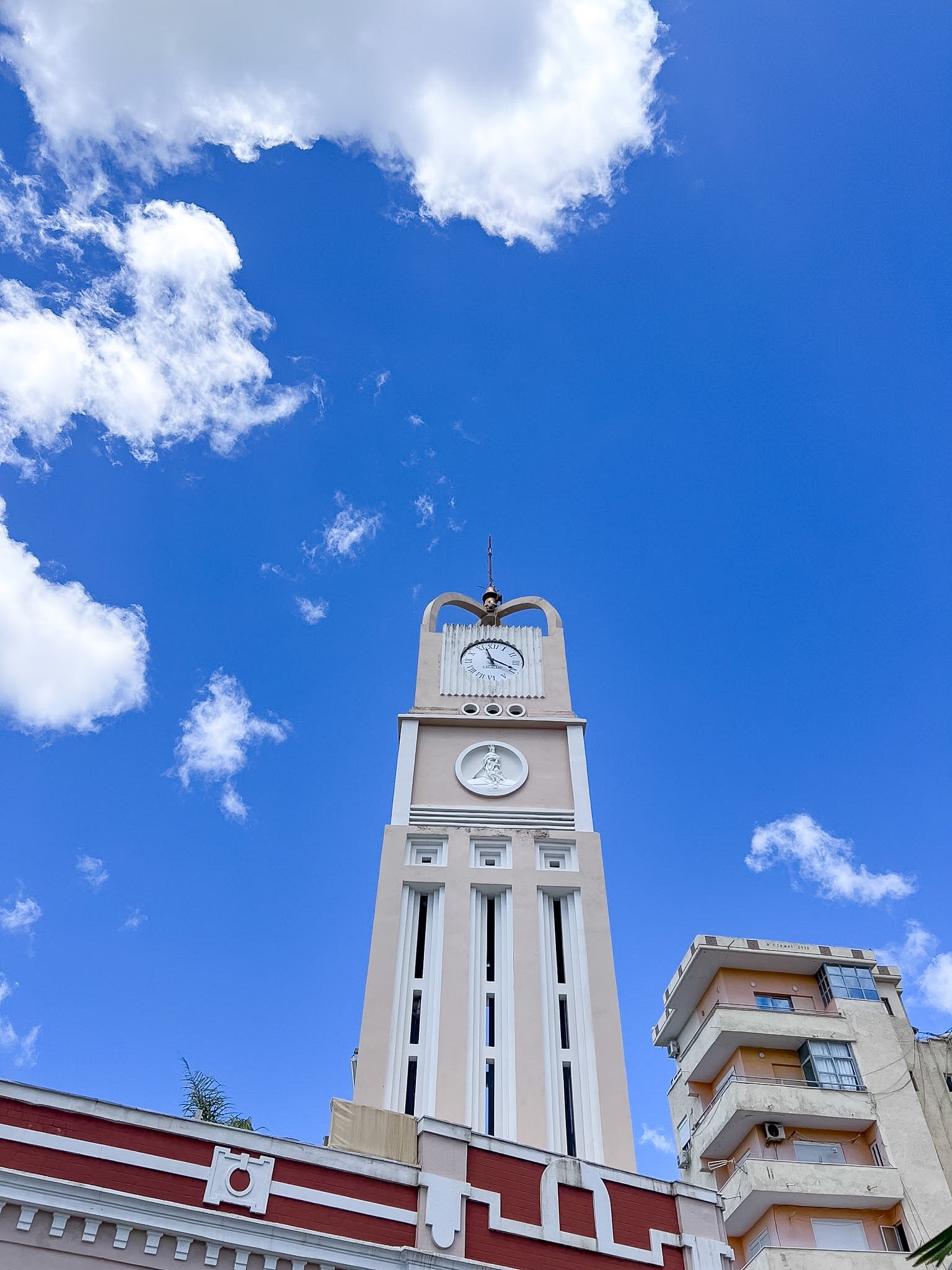White clock tower against a bright blue sky, Vlore, Albania