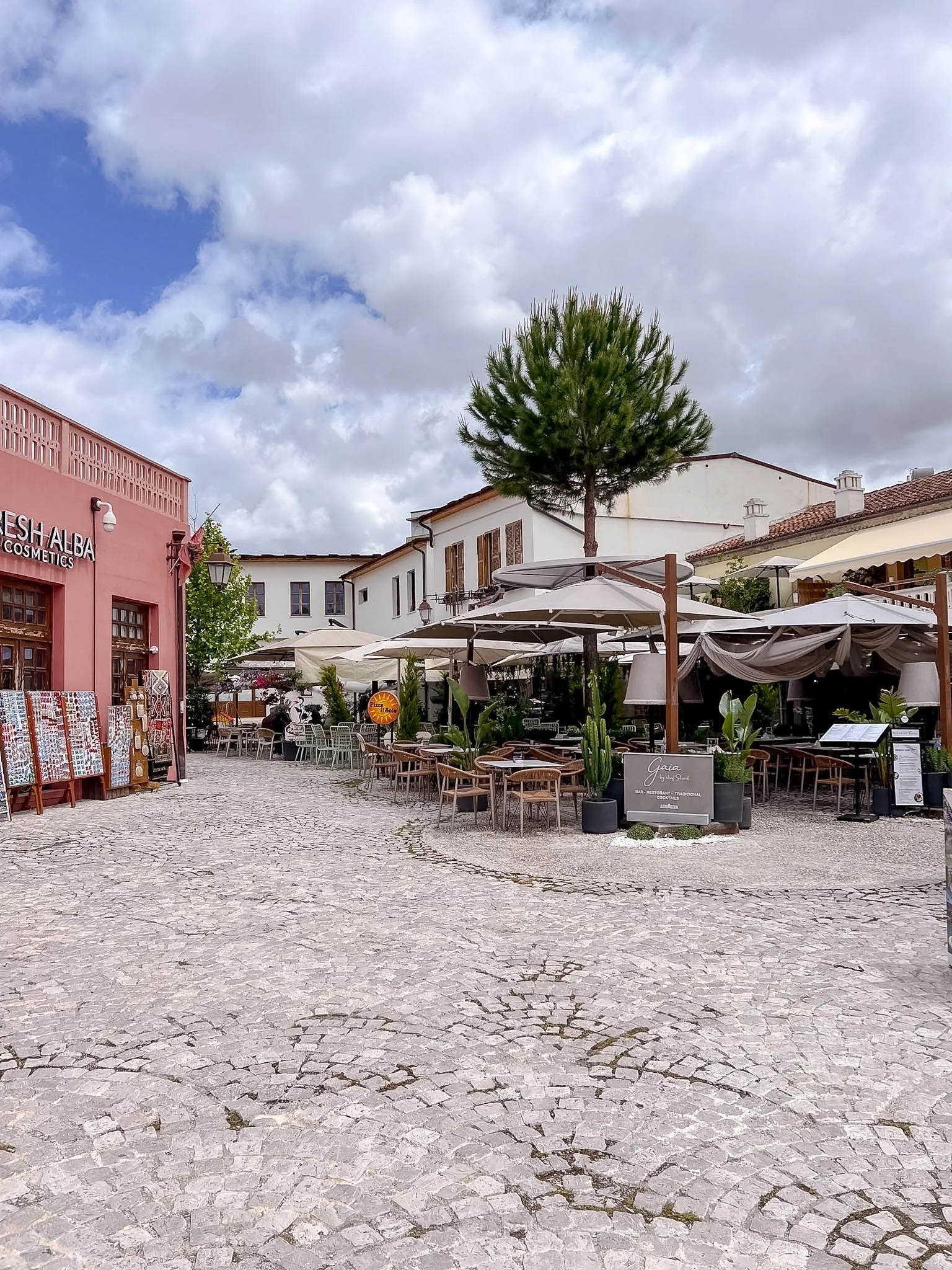 Cobbled square lined with cafés and restaurants in Vlore Old Town, Albania