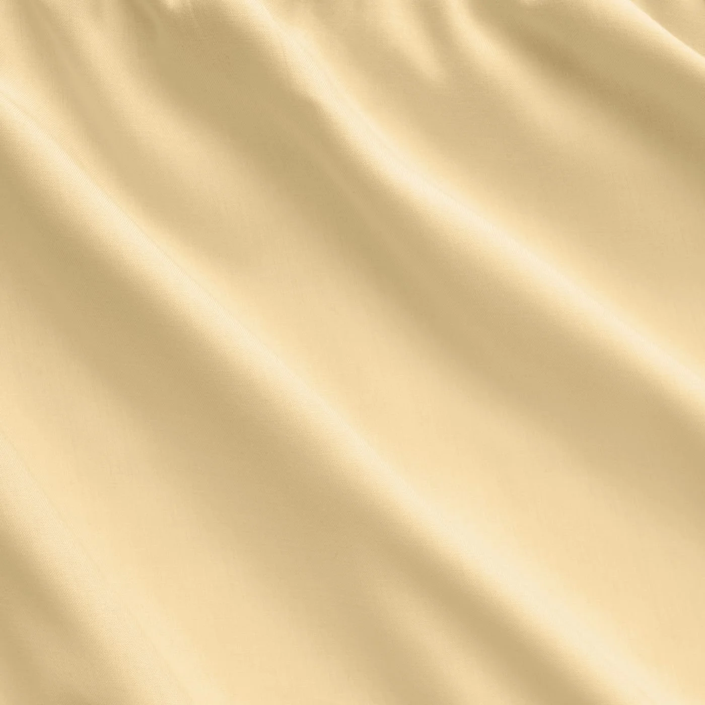 Close-up of a shiny gold satin fabric with diagonal folds.