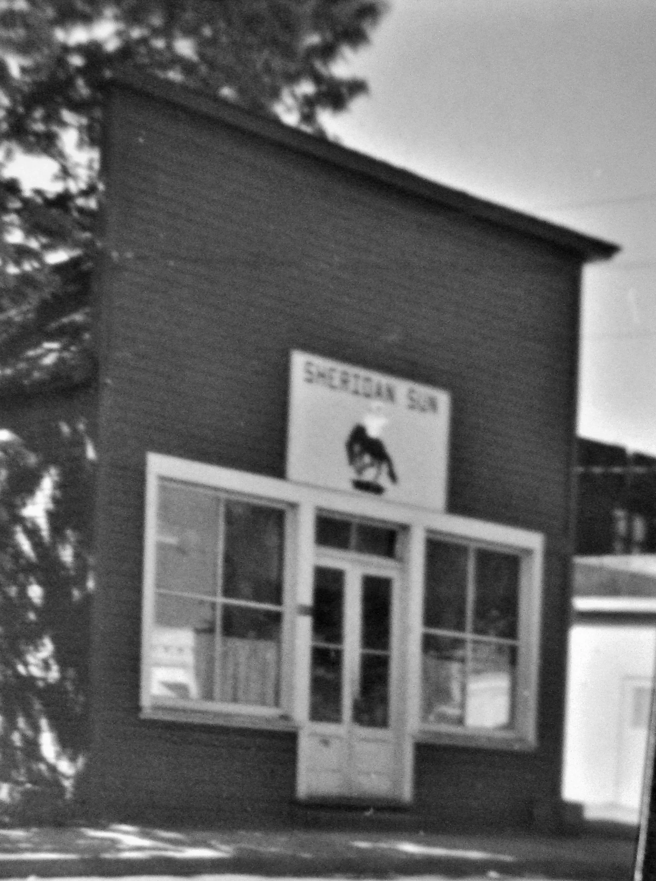 The original Sheridan Sun office burned down in 1913.  This building was on Harney Street and was the headquarters for the paper until 1978.  The paper ceased publishing in 2014 and the building was torn down.