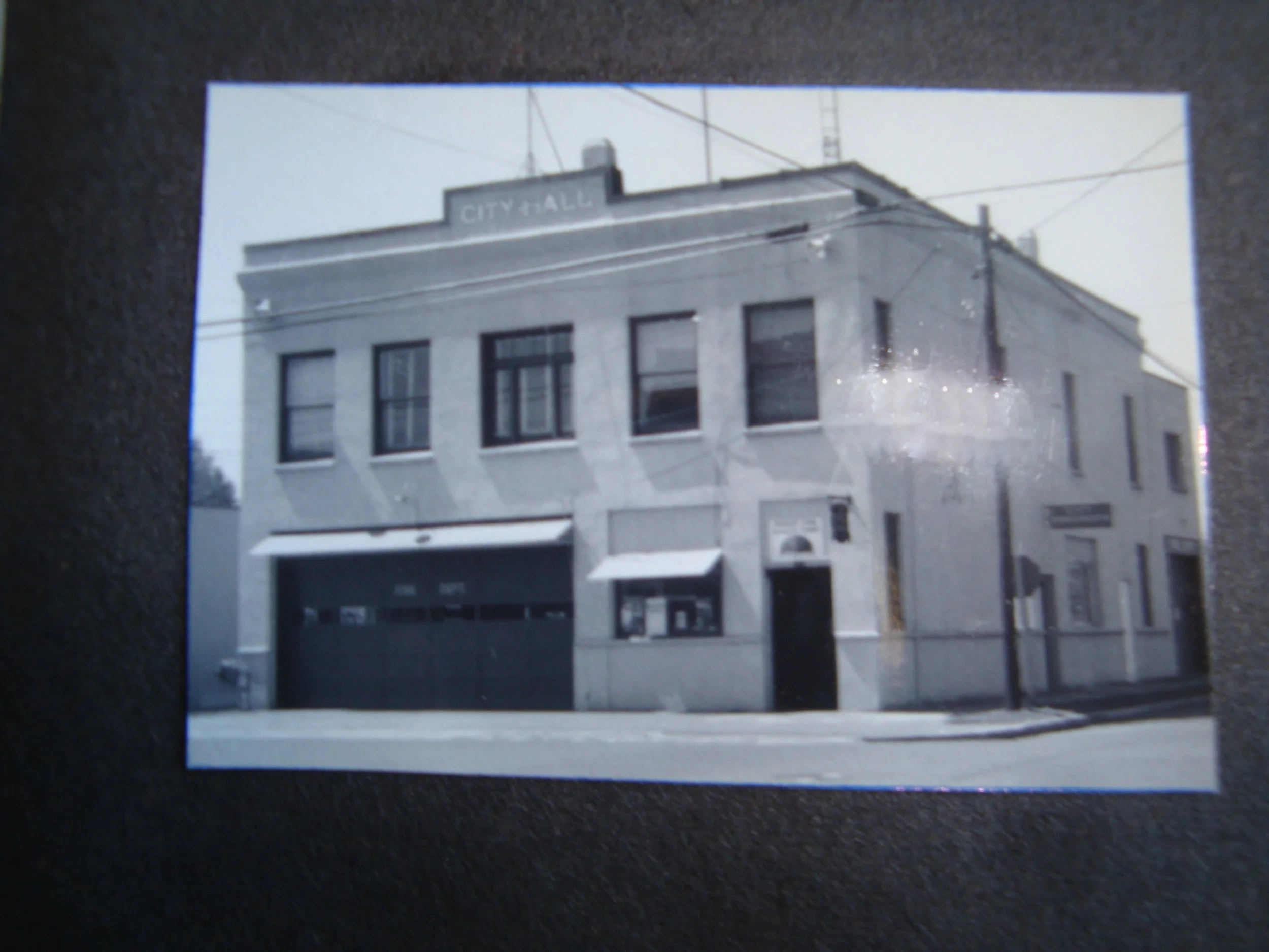 Sheridan’s original city hall was constructed on N. Bridge Street in 1916.  In 1926 the library moved upstairs and was there until 1973.  The volunteer fire department used the lower floor until 1984.  The police station and jail were also on the low