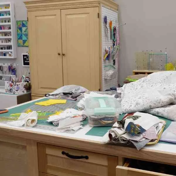 This is a picture of my cutting table after a day of sewing. It is very messy!