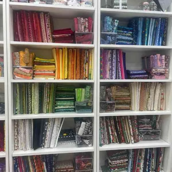 Fabric Organized on Book Shelves