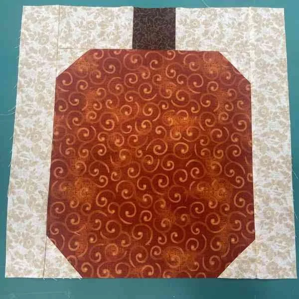 Scrappy pumpkin quilt block