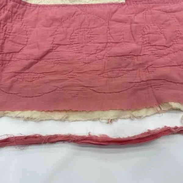 Shows the wear on the top of the antique state quilt