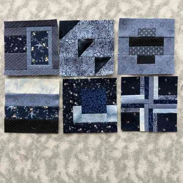 Six navy blue blocks from the book 100 Modern Quilt Blocks by Tula Pink