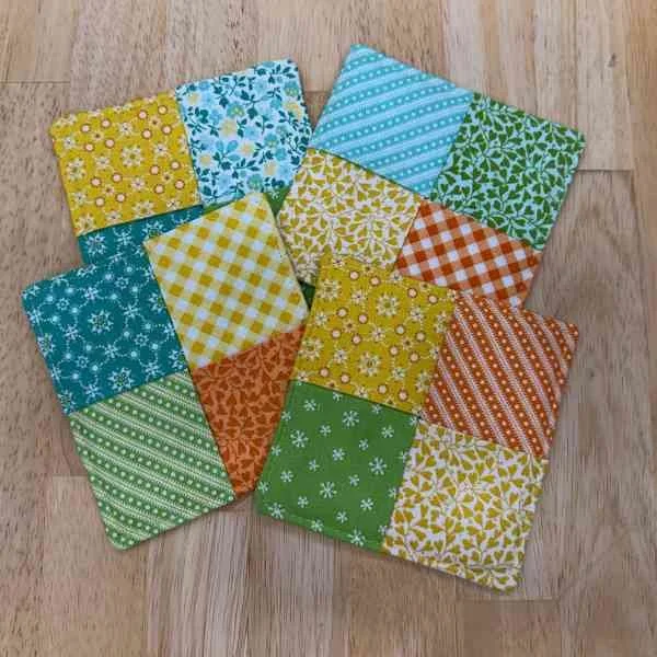 Bright orange, yellow, green and blue drink coasters
