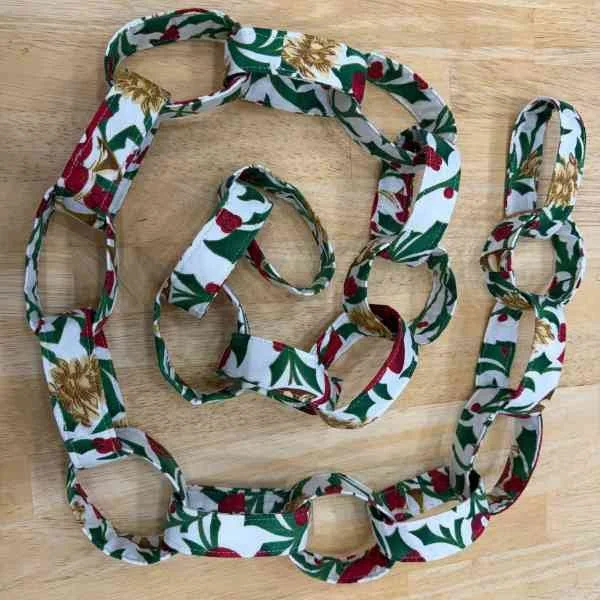 Fabric loop garland white, red, and green.
