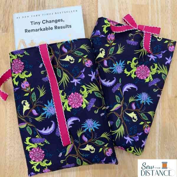 Two pink and purple fabric book sleeves