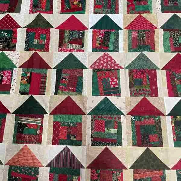 Quilt made of houses where the roof is a flying geese pattern