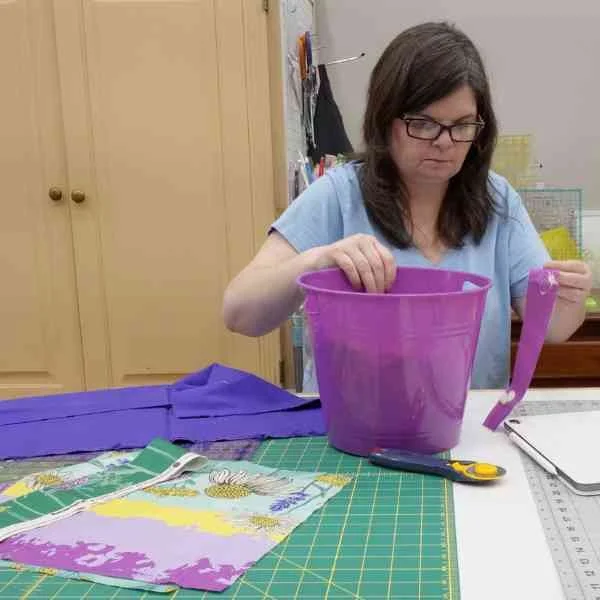 Kris cleaning up her cutting table.