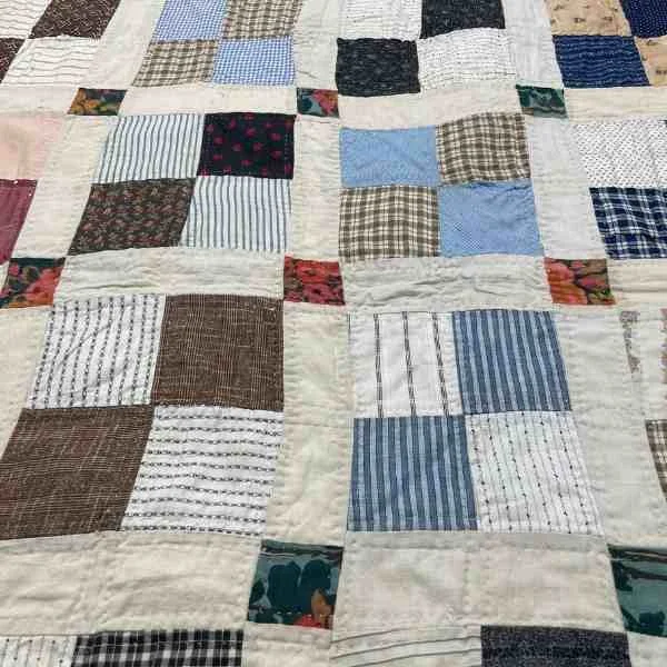Sashing and cornerstones on antique four patch scrap quilt