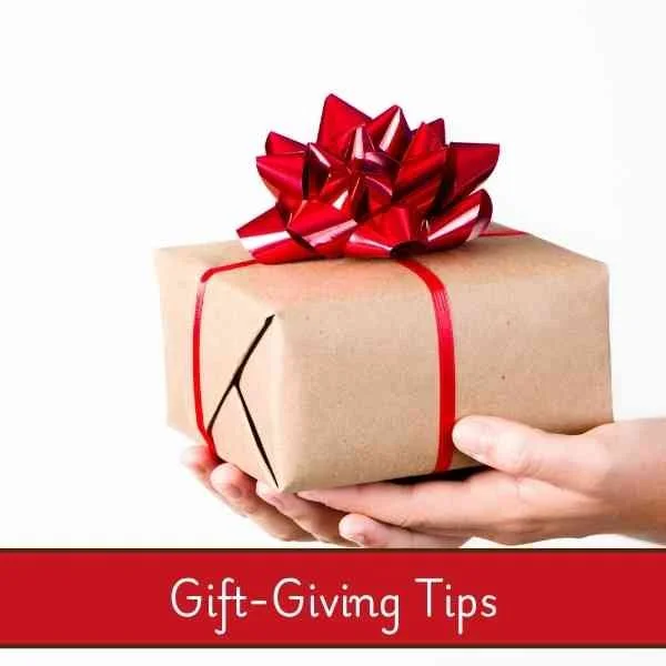 brown wrapped box with a red bow and the words "gift giving tips" on the picture