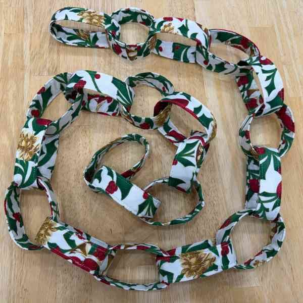 White, red, and green fabric loop garland