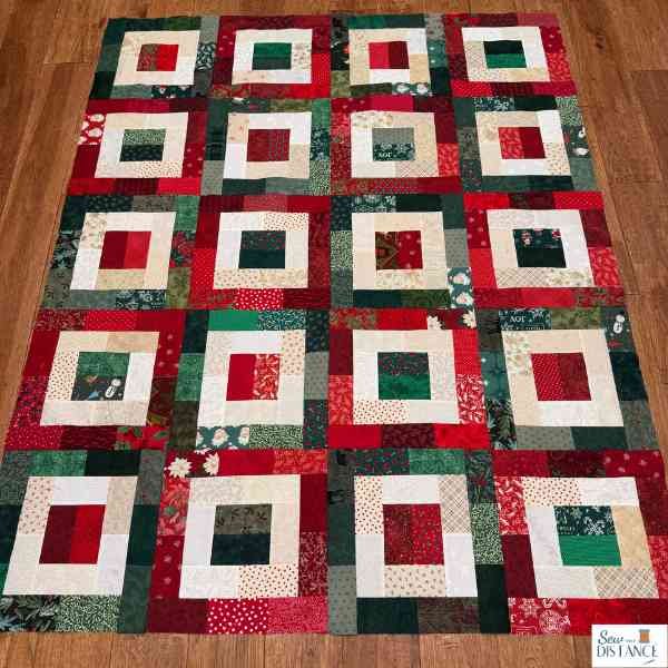 Finished Christmas quilt top in red and green