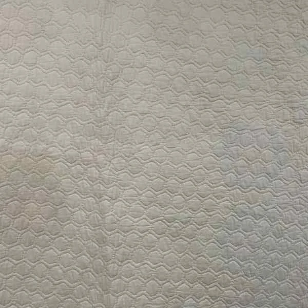 Back of Grandmother's Flower Garden Quilt showing the hand quilting
