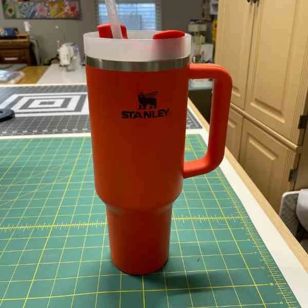 Orange Stanley thermos cup