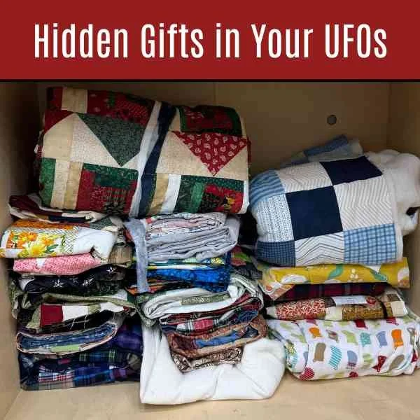 A stack of flimsies or quilt tops in a cabinet