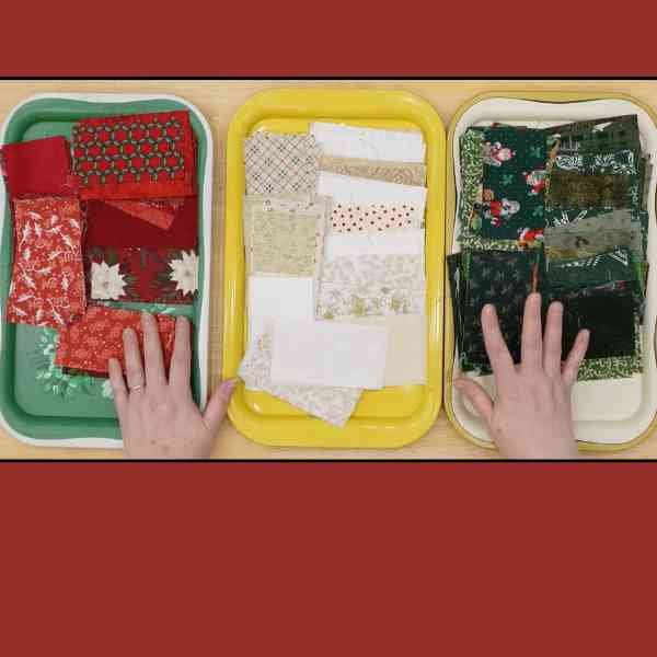 Three trays with red, beige, and green rectangle pieces on them