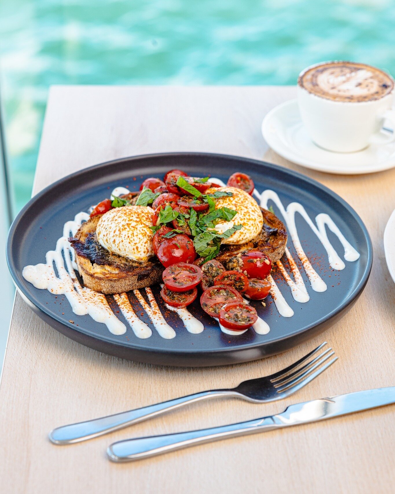 What's on Billi's Eggs? 

Chilli buttered eggs, braised garlic tomatoes, onion jam, burnt butter glaze, fresh mint and Greek yoghurt on toasted sourdough.

#CelsiusCoffeeCo

#sydneycoffee #sydneycafe #coffeeshop #cafes #waterviews  #sydneybrunchspots