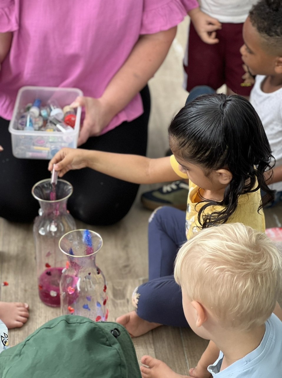 Children doing science experiment at Scotts Road Child Care Centre.jpeg