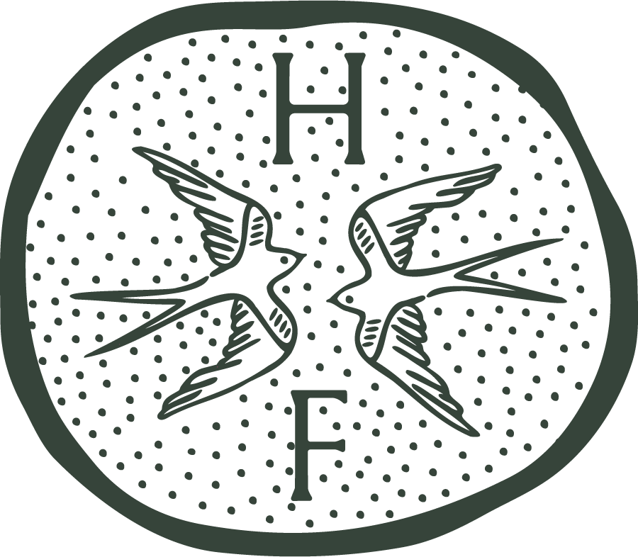 A circular logo with two stylized, symmetrical birds facing each other, a large letter H at the top, and a large letter F at the bottom, all set against a dotted background.