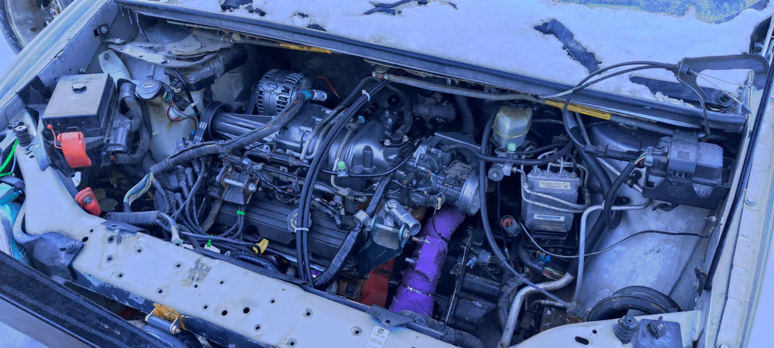 U-body van engine bay with L67 3.8L supercharged V6 installed