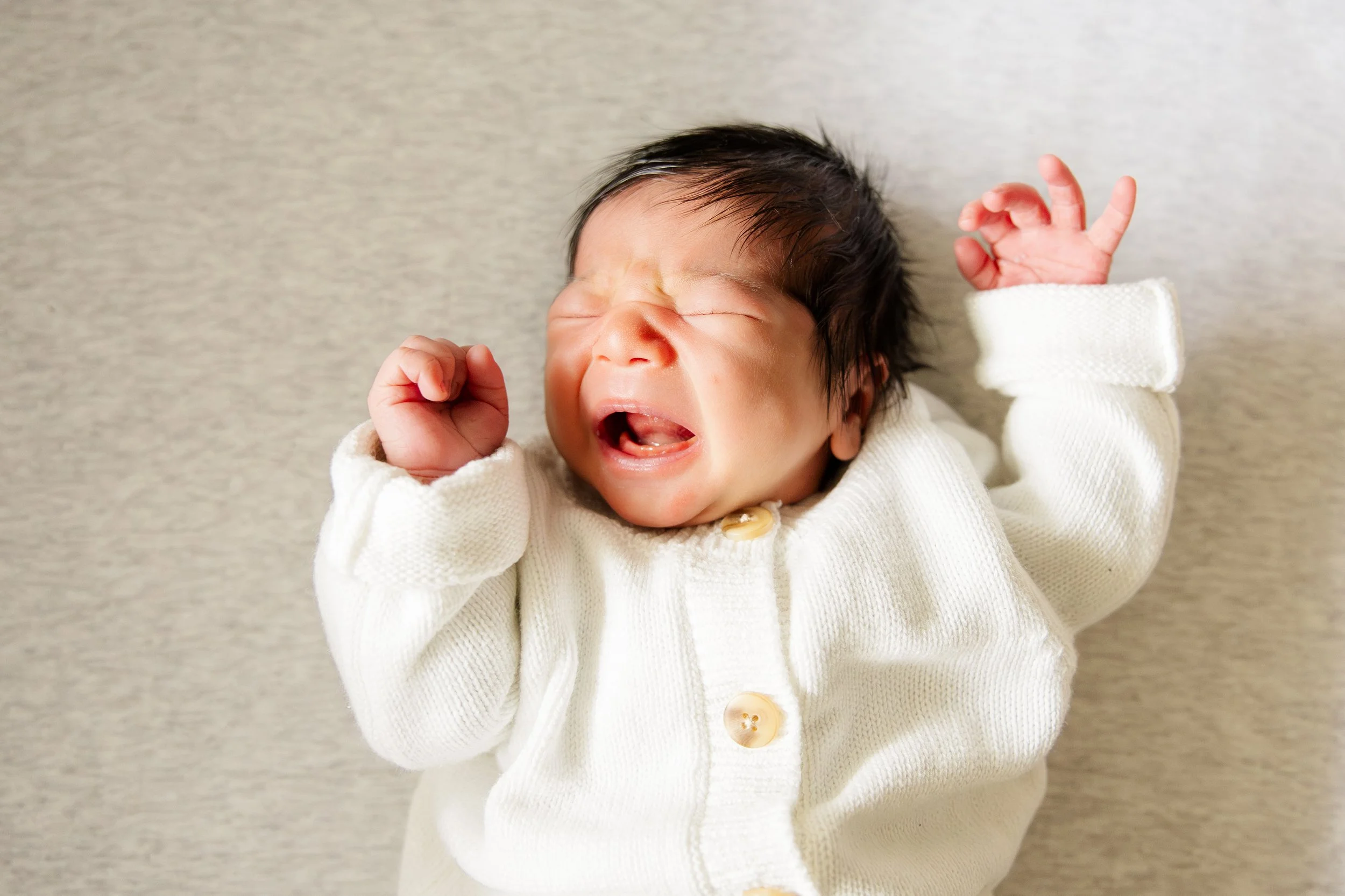 What If My Baby Won’t Settle During Newborn Photos?
