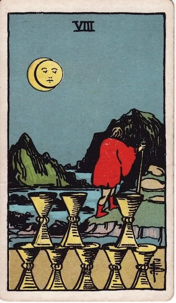 Eight of Cups tarot card — a cloaked figure walks away from eight arranged cups toward distant mountains under a crescent moon. Rider-Waite-Smith Tarot Deck.