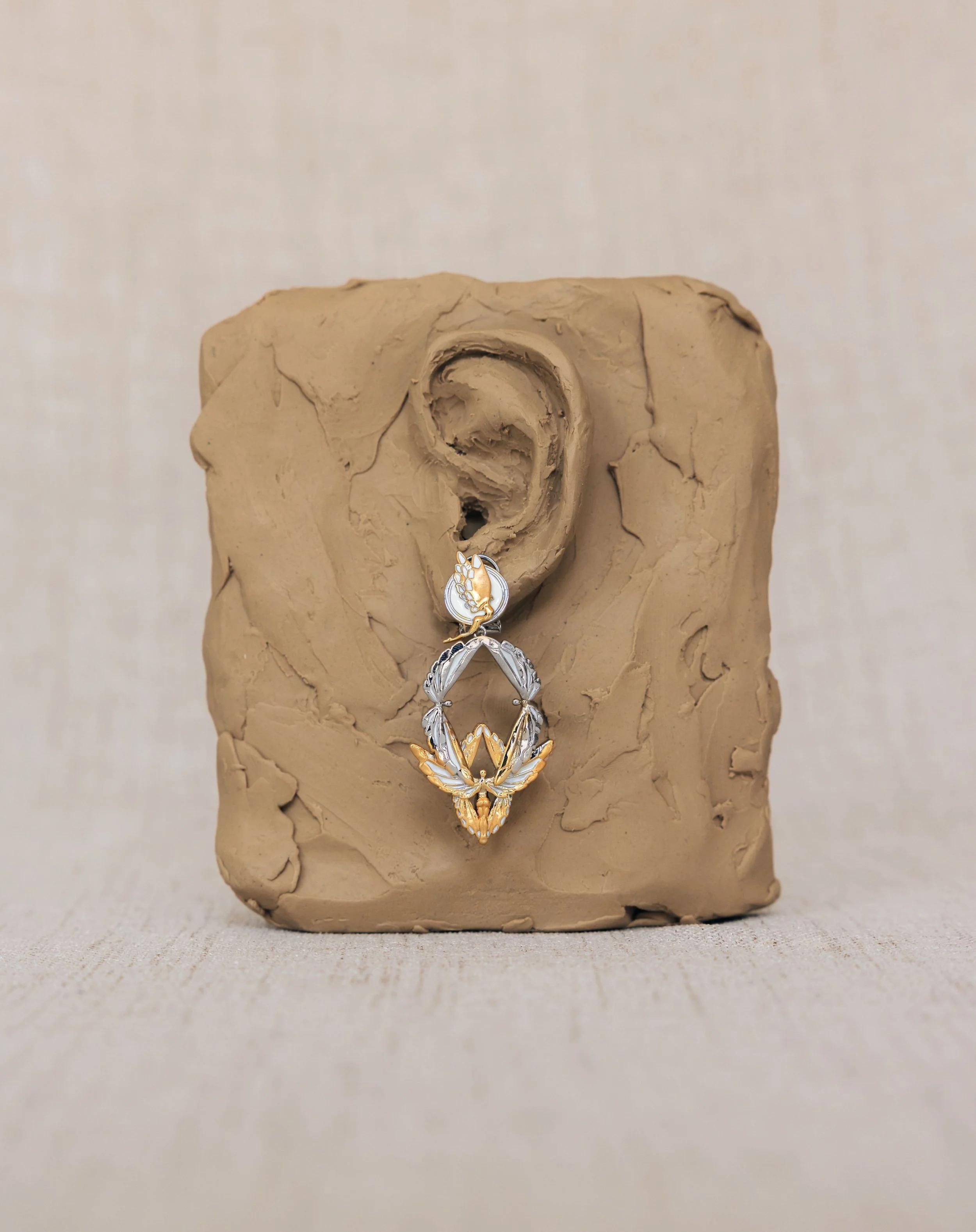 Soaring earring WR 2T on clay ear.jpg