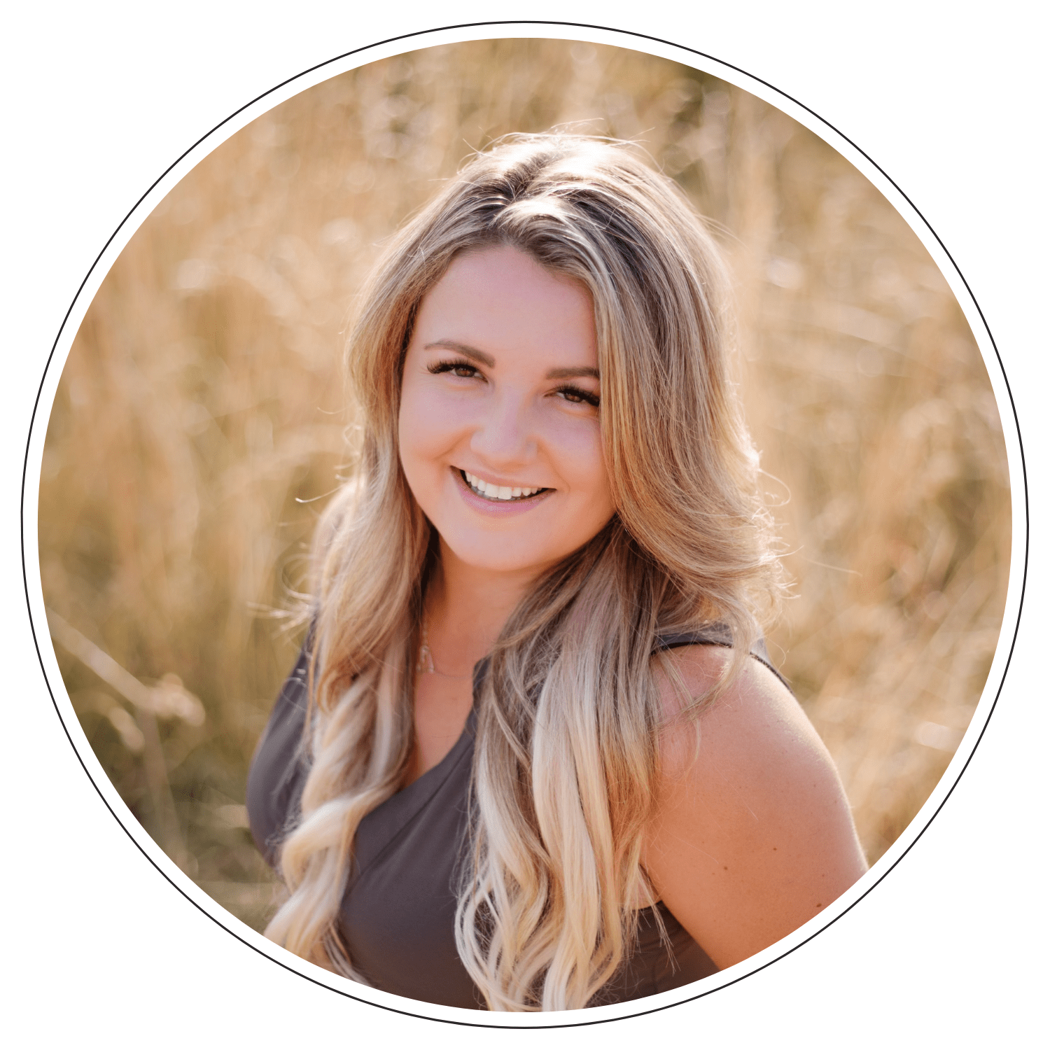 Smiling woman with long blonde hair outdoors