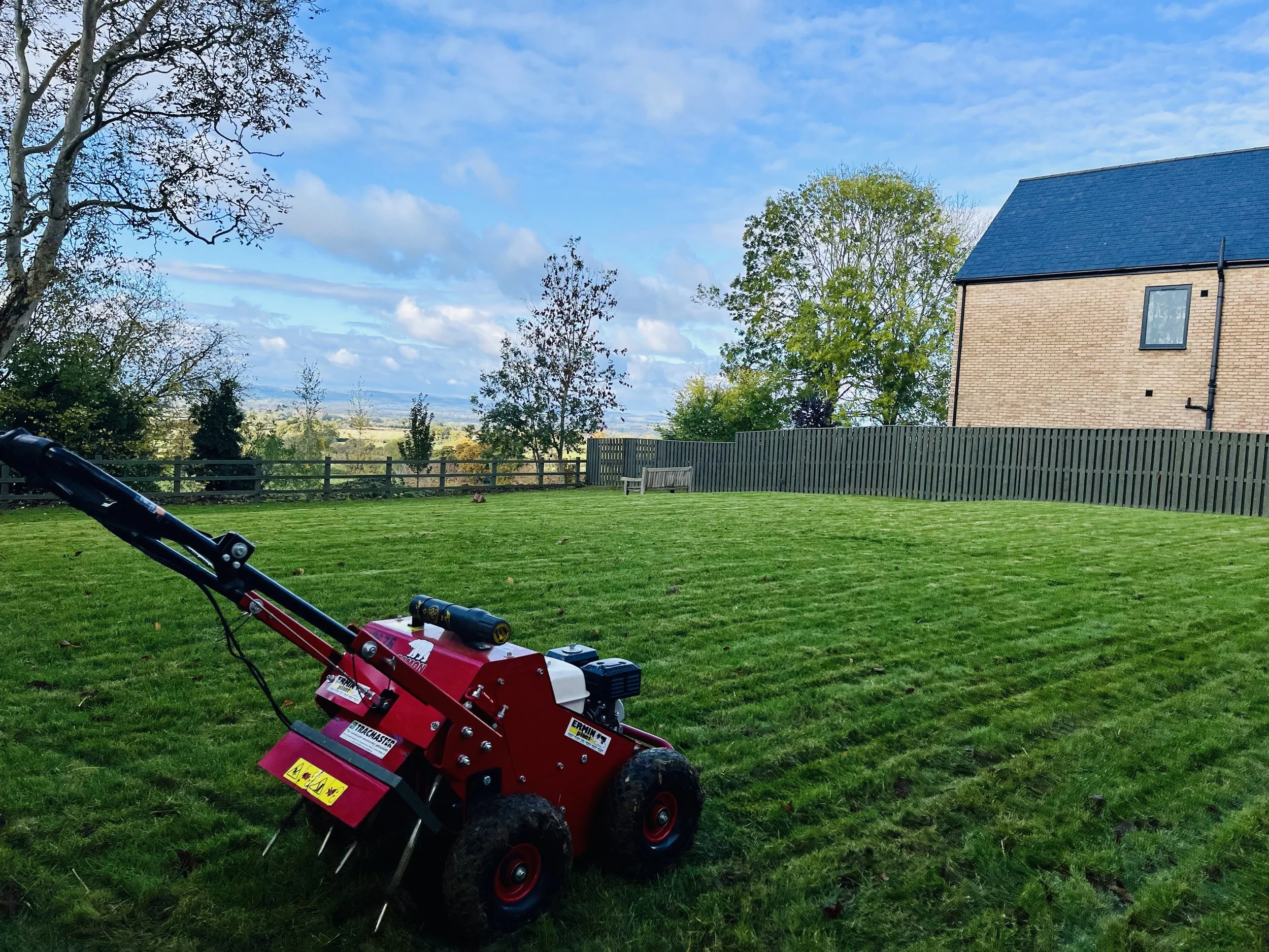 Professional lawn scarification in Stroud, Gloucestershire, removing moss and thatch to improve drainage, encourage healthy grass growth and restore a stronger lawn.