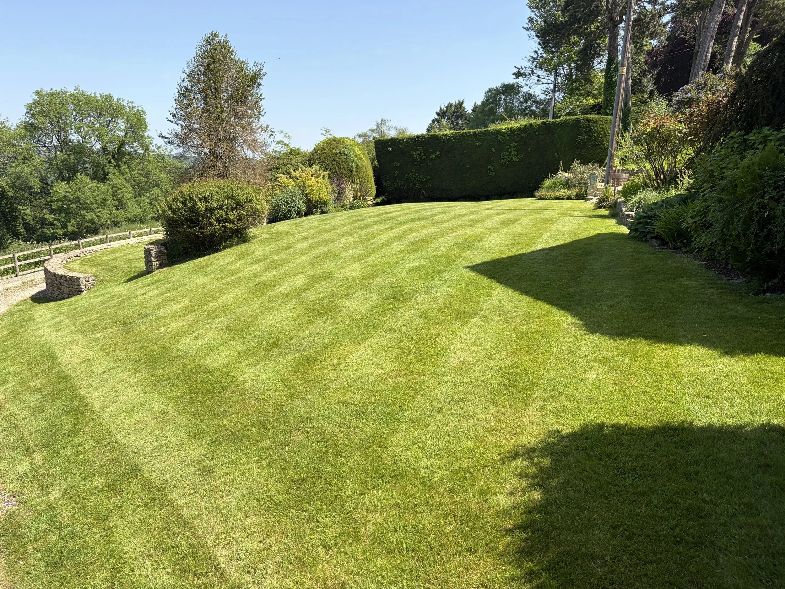Professional lawn mowing and garden maintenance in Stroud, Gloucestershire, keeping large lawns healthy, neat and well maintained throughout the growing season.