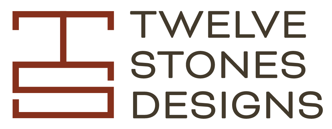 Logo for Twelve Stones Designs with a stylized red stone outline on the left and black text on the right.