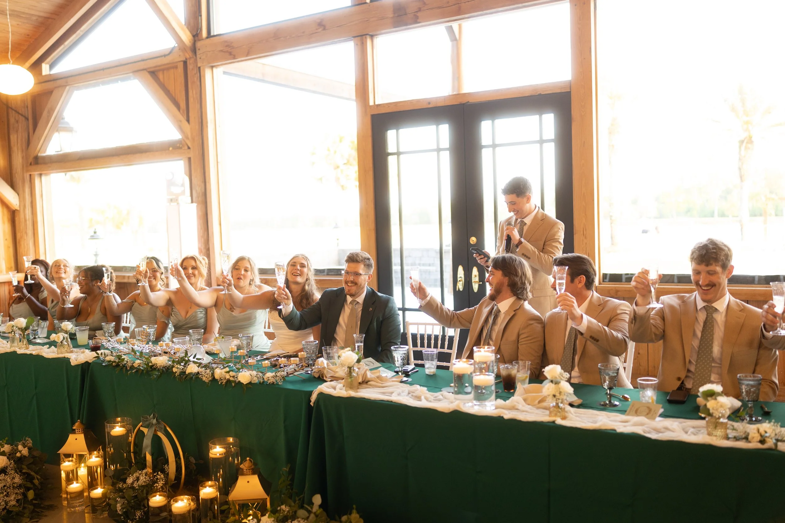 Family and friends raise a toast to the newlyweds during the wedding reception.