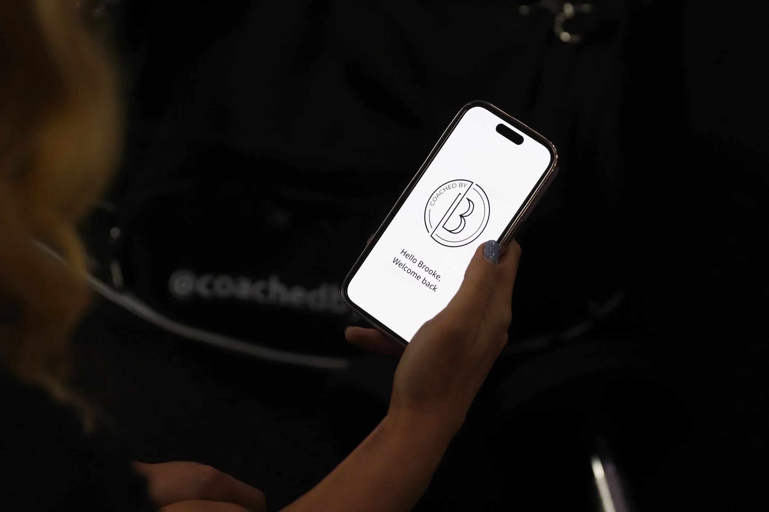 The Coached by B app showing training and nutrition tracking