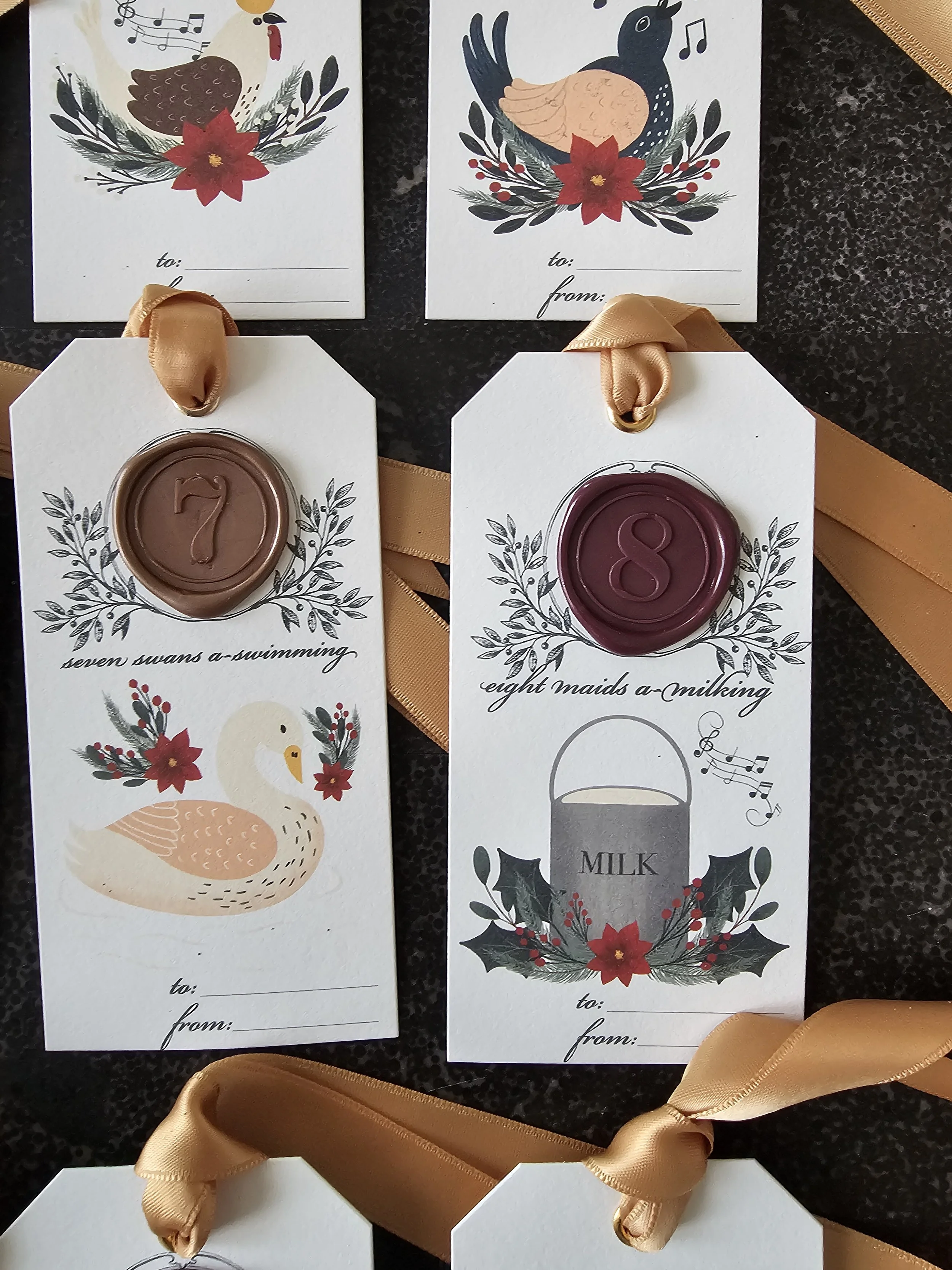 Heirloom-style holiday tags with wax seals and folkloric illustrations inspired by 12 Days of Christmas.