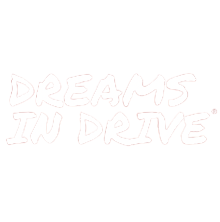 Text that says 'DREAMS INTO DARE' in white, glowing, stylized font.