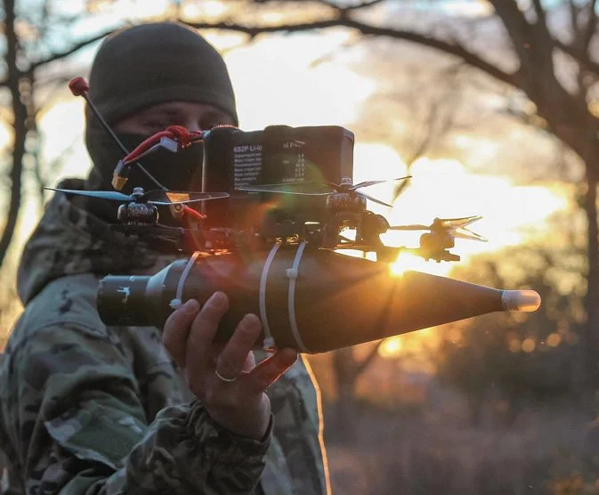 A soldier holding an FPV drone.