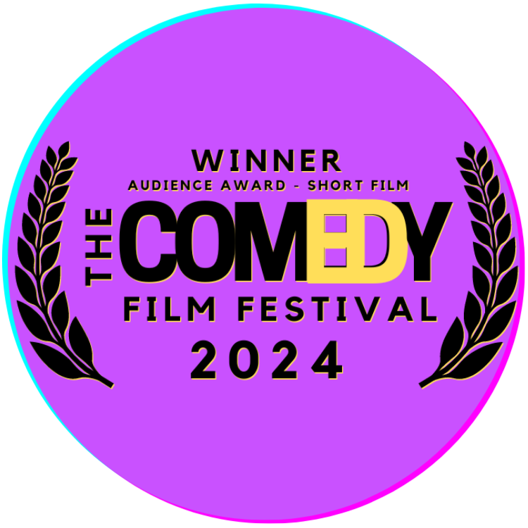 Purple circular award badge for the 2024 Comedy Film Festival, indicating a winner of the audience award for short film, with black laurel branches on each side and yellow and black text.